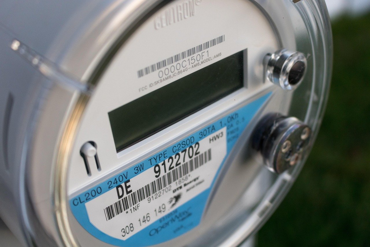 Close-up of a silver electricity meter with a blank digital display and a label reading CL200 240V 3W
