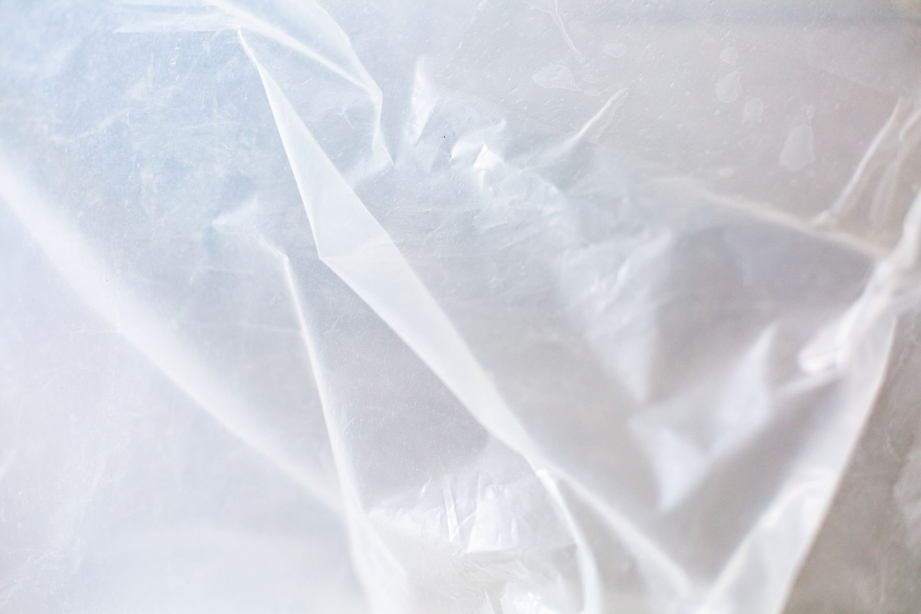 Close-up of crumpled, translucent white plastic sheeting